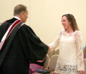 MTSO President Jay Rundell congratulates Jennifer Stockwell, recipient of the Ronald L. Williams Book Prize