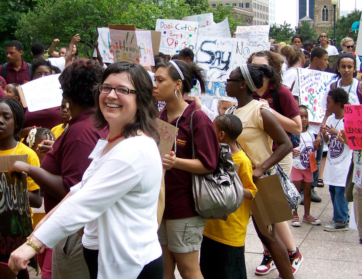 MTSO alum Laura Young (white sweater) leads scholars from Broad Street UMC to the Ohio Statehouse during the National Day of Social Action July 13