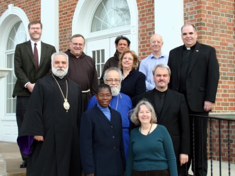 Lancaster (in green sweater) and her WCC colleagues on the steps of the Dickhaut Library